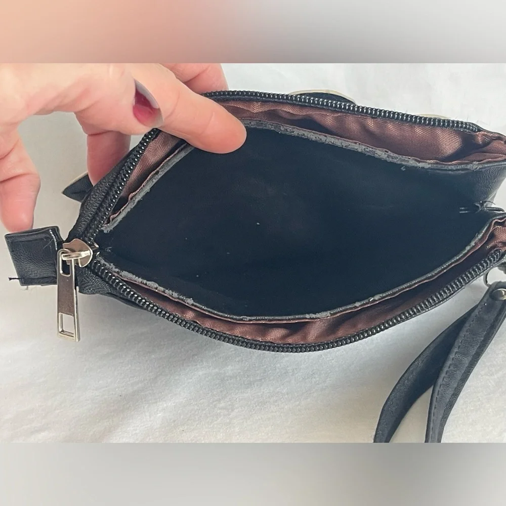 Fun little black faux, leather clutch wristlet three pocket with a zipper